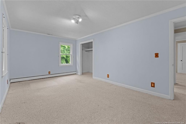 472 Walter Bright Rd, Sanford, NC 27330 - unfurnished bedroom with a baseboard heating unit, crown molding, carpet, baseboards, and a closet