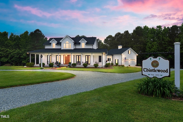 4737 Uzzle Rd, Rougemont, NC 27572 - modern farmhouse with driveway, covered porch, and a lawn