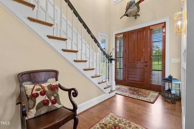 4737 Uzzle Rd, Rougemont, NC 27572 - foyer with wood finished floors, stairs, a high ceiling, and baseboards