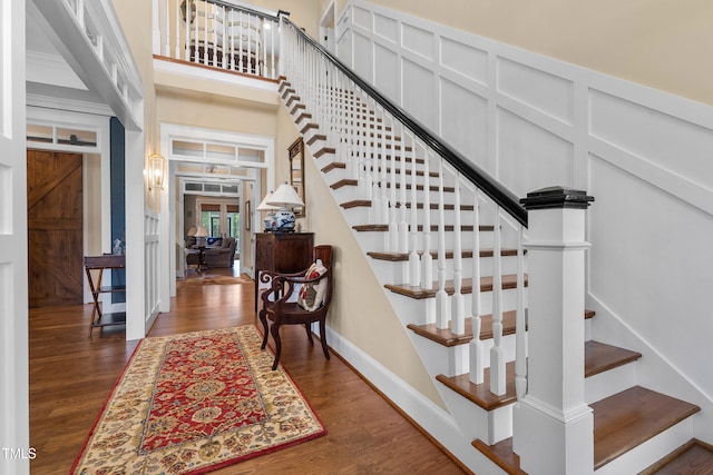 4737 Uzzle Rd, Rougemont, NC 27572 - staircase with wood finished floors, french doors, a high ceiling, and baseboards