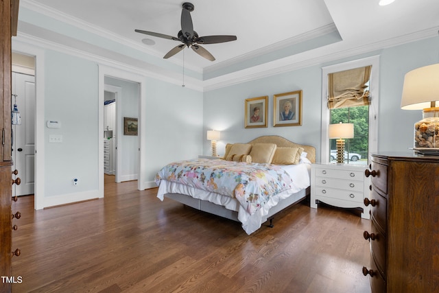 4737 Uzzle Rd, Rougemont, NC 27572 - bedroom with dark wood-style flooring, crown molding, baseboards, a tray ceiling, and a ceiling fan