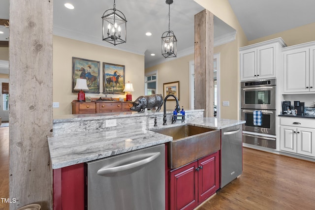 4737 Uzzle Rd, Rougemont, NC 27572 - kitchen featuring stainless steel appliances, a warming drawer, a sink, ornamental molding, and wood finished floors