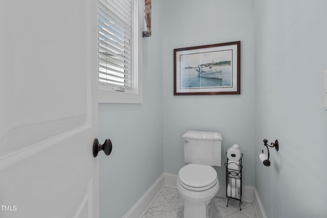 4737 Uzzle Rd, Rougemont, NC 27572 - bathroom featuring marble look tile flooring, toilet, and baseboards