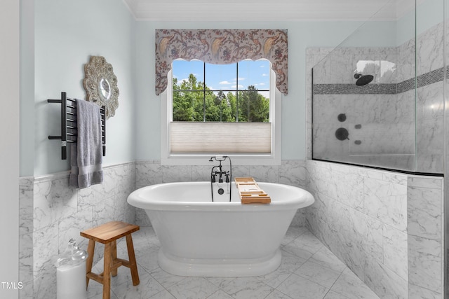 4737 Uzzle Rd, Rougemont, NC 27572 - bathroom with tile walls, a freestanding tub, a wainscoted wall, tiled shower, and a towel warmer