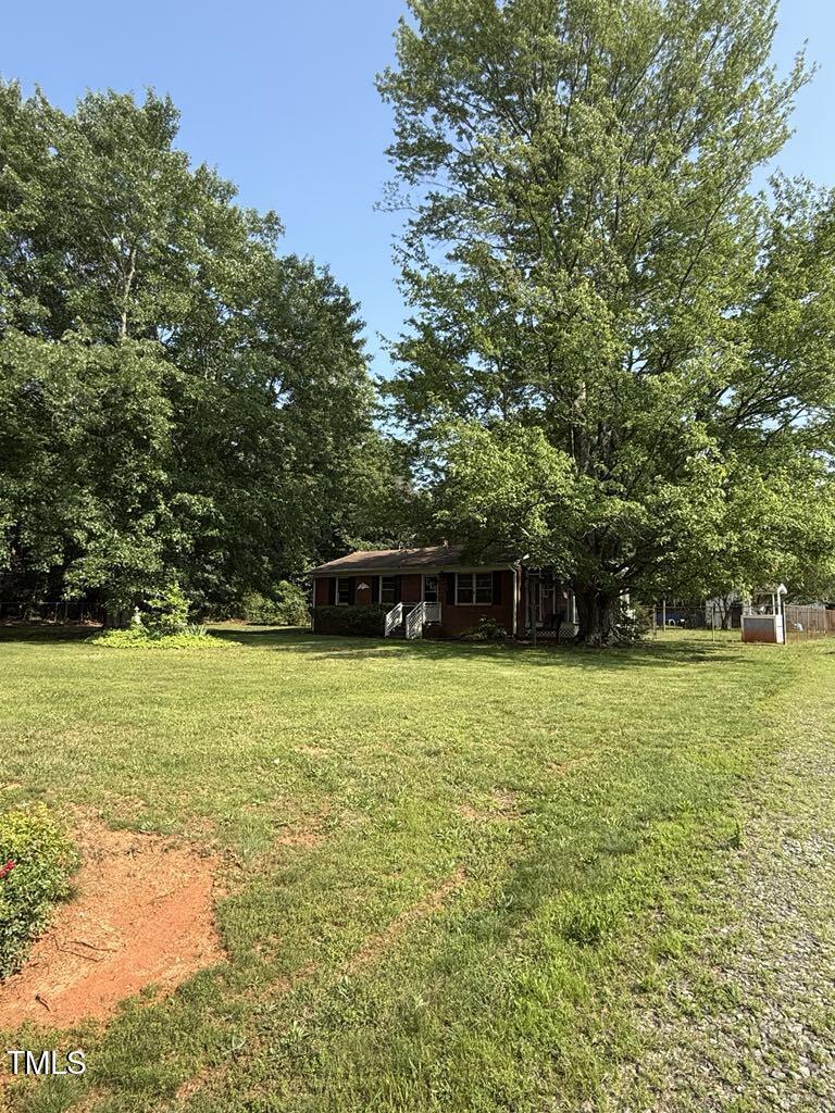 1115 Zeb Rd, Gibsonville, NC 27249 - view of green lawn