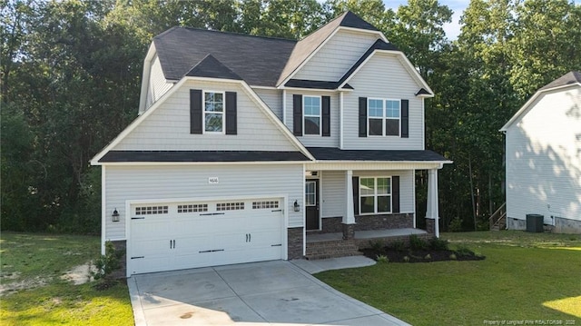 4616 Scenic Pines Dr, Hope Mills, NC 28348 - craftsman inspired home featuring covered porch, driveway, a front yard, and stone siding