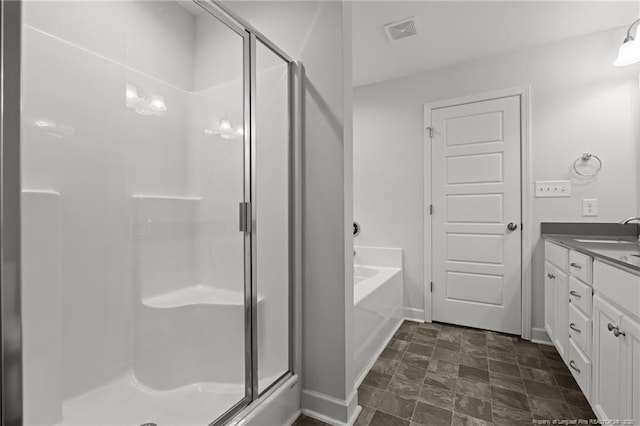 4616 Scenic Pines Dr, Hope Mills, NC 28348 - full bath featuring a stall shower, baseboards, vanity, a garden tub, and stone finish floors
