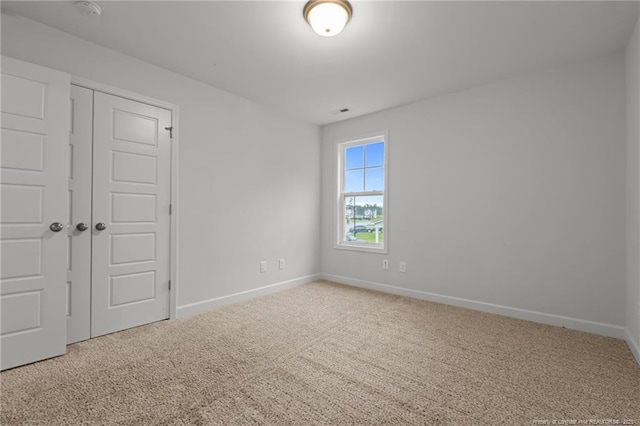 4616 Scenic Pines Dr, Hope Mills, NC 28348 - unfurnished bedroom featuring carpet flooring, baseboards, and a closet