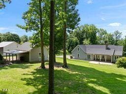 311 Rassie Crabtree Rd, Rougemont, NC 27572 - view of green lawn featuring a porch