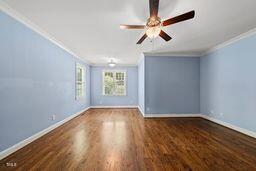 311 Rassie Crabtree Rd, Rougemont, NC 27572 - empty room with ornamental molding, ceiling fan, and wood finished floors