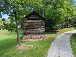 311 Rassie Crabtree Rd, Rougemont, NC 27572 - view of property's community with a lawn