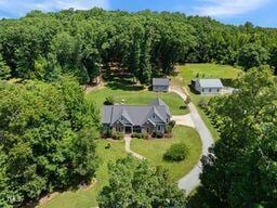 311 Rassie Crabtree Rd, Rougemont, NC 27572 - view of subject property with a forest