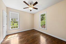 311 Rassie Crabtree Rd, Rougemont, NC 27572 - unfurnished room featuring wood finished floors and a ceiling fan