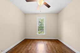 311 Rassie Crabtree Rd, Rougemont, NC 27572 - spare room with ceiling fan and wood finished floors
