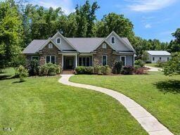 311 Rassie Crabtree Rd, Rougemont, NC 27572 - view of front of home with a front lawn