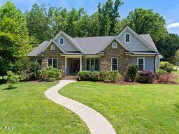 311 Rassie Crabtree Rd, Rougemont, NC 27572 - view of front of house featuring a front lawn and covered porch