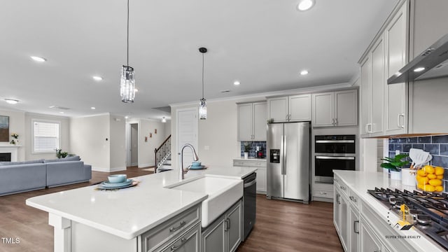 3421 Lebrun Path, Fuquay Varina, NC 27526 - kitchen featuring appliances with stainless steel finishes, gray cabinets, wall chimney exhaust hood, tasteful backsplash, and recessed lighting