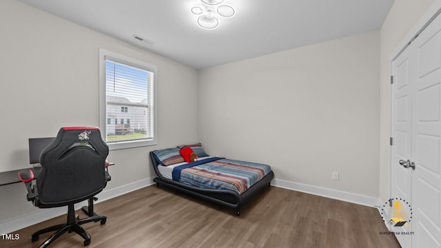 3421 Lebrun Path, Fuquay Varina, NC 27526 - bedroom featuring wood finished floors and a desk