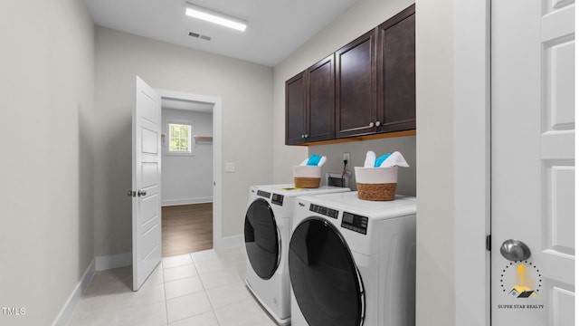 3421 Lebrun Path, Fuquay Varina, NC 27526 - washroom featuring washing machine and clothes dryer, cabinet space, and light tile patterned floors