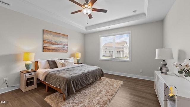 3421 Lebrun Path, Fuquay Varina, NC 27526 - bedroom featuring a tray ceiling, dark wood finished floors, and a ceiling fan