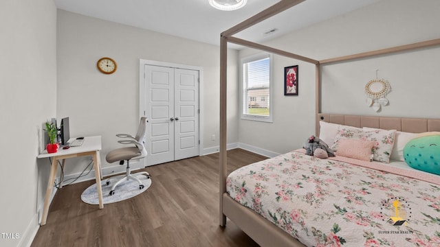 3421 Lebrun Path, Fuquay Varina, NC 27526 - bedroom featuring wood finished floors, a closet, and a desk
