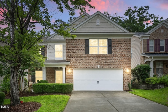 518 Emerald Downs Rd, Cary, NC 27519 - view of front of home featuring an attached garage, concrete driveway, and brick siding