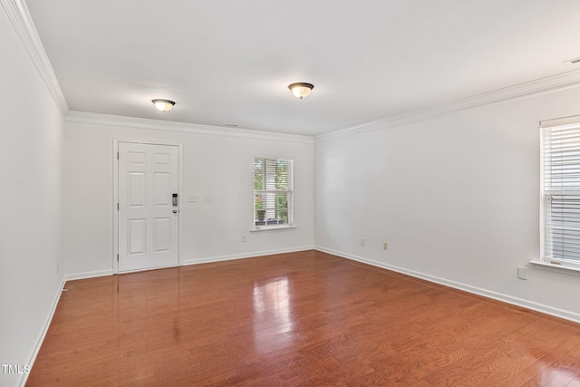 518 Emerald Downs Rd, Cary, NC 27519 - spare room featuring ornamental molding and wood finished floors