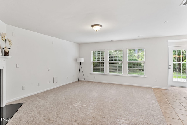 518 Emerald Downs Rd, Cary, NC 27519 - empty room with light colored carpet, a fireplace, and light tile patterned flooring