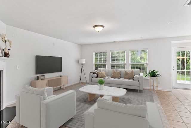 518 Emerald Downs Rd, Cary, NC 27519 - living room with a fireplace and light tile patterned floors