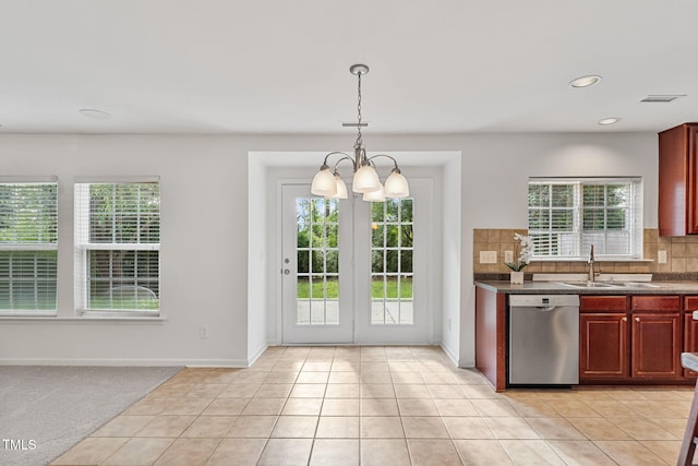 518 Emerald Downs Rd, Cary, NC 27519 - kitchen with dishwasher, dark countertops, dark brown cabinets, tasteful backsplash, and a chandelier
