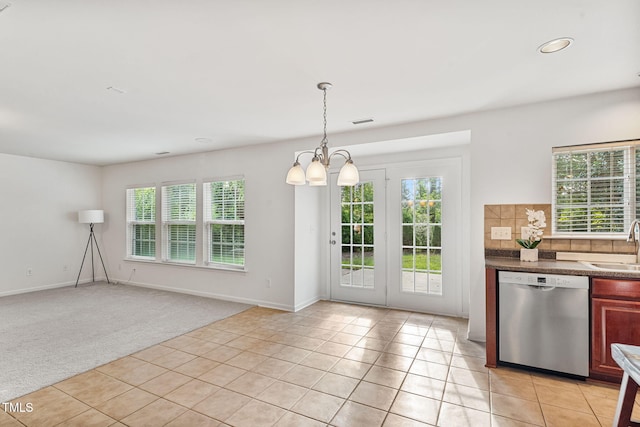 518 Emerald Downs Rd, Cary, NC 27519 - kitchen featuring stainless steel dishwasher, healthy amount of natural light, light tile patterned flooring, dark countertops, and recessed lighting