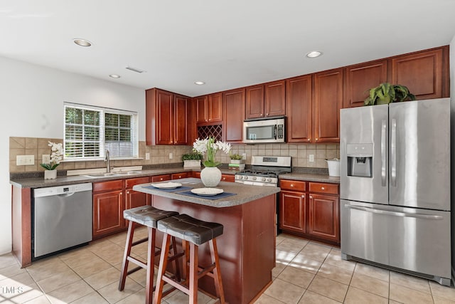 518 Emerald Downs Rd, Cary, NC 27519 - kitchen with appliances with stainless steel finishes, light tile patterned floors, backsplash, dark countertops, and recessed lighting