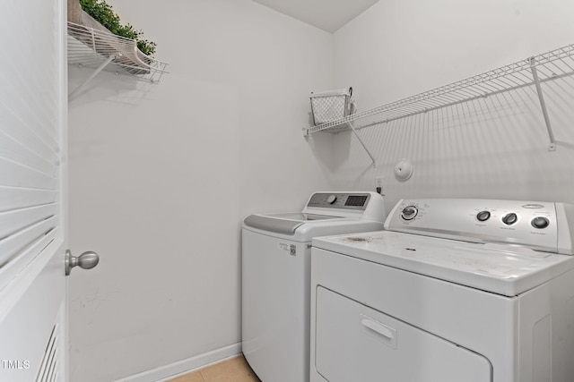 518 Emerald Downs Rd, Cary, NC 27519 - washroom with separate washer and dryer and light tile patterned floors