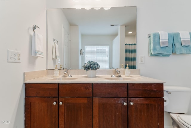 518 Emerald Downs Rd, Cary, NC 27519 - full bathroom featuring toilet and double vanity