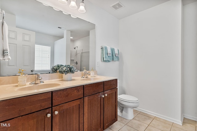 518 Emerald Downs Rd, Cary, NC 27519 - full bathroom with tile patterned floors, double vanity, and a stall shower
