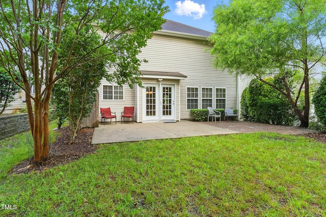 518 Emerald Downs Rd, Cary, NC 27519 - rear view of property with a patio area, a lawn, and french doors
