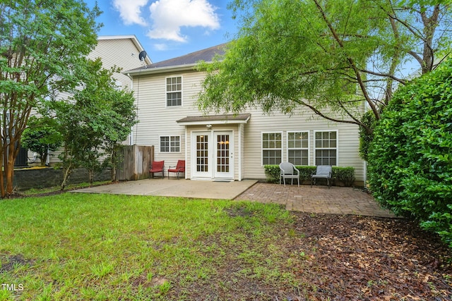 518 Emerald Downs Rd, Cary, NC 27519 - back of property with a patio and french doors