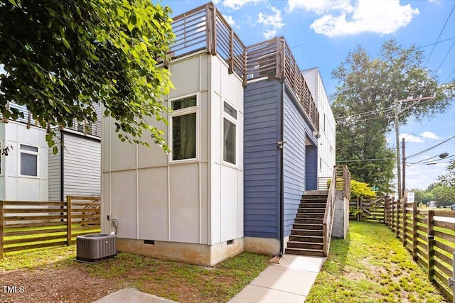 1314 S E St, Raleigh, NC 27601 - view of side of property with crawl space, stairway, and central AC