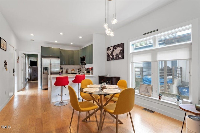 1314 S E St, Raleigh, NC 27601 - dining space featuring light wood-type flooring, baseboards, and recessed lighting