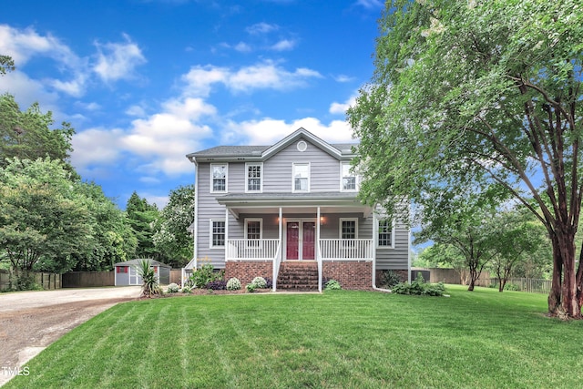 8121 Bentwood Pl, Raleigh, NC 27615 - view of front facade featuring a porch, driveway, and an outbuilding