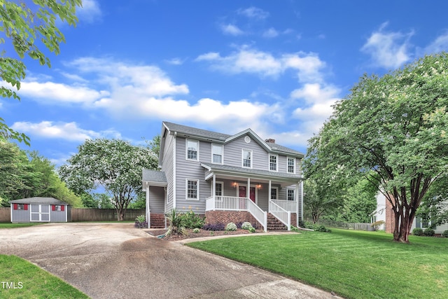 8121 Bentwood Pl, Raleigh, NC 27615 - view of front facade featuring a porch, concrete driveway, a chimney, and stairs
