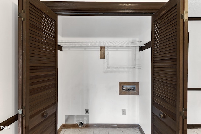 8121 Bentwood Pl, Raleigh, NC 27615 - laundry room featuring hookup for an electric dryer, hookup for a washing machine, baseboards, and tile patterned flooring
