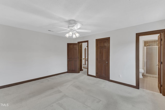 8121 Bentwood Pl, Raleigh, NC 27615 - unfurnished bedroom with baseboards, light carpet, ensuite bathroom, and ceiling fan
