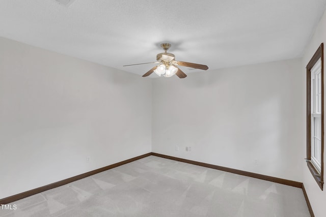 8121 Bentwood Pl, Raleigh, NC 27615 - empty room with a ceiling fan, light colored carpet, and baseboards