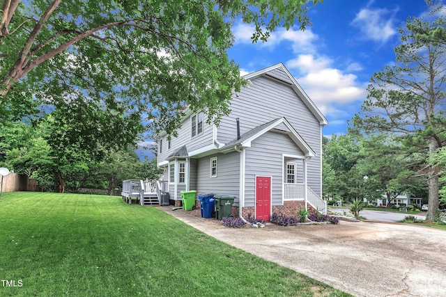 8121 Bentwood Pl, Raleigh, NC 27615 - rear view of house featuring a yard and a deck