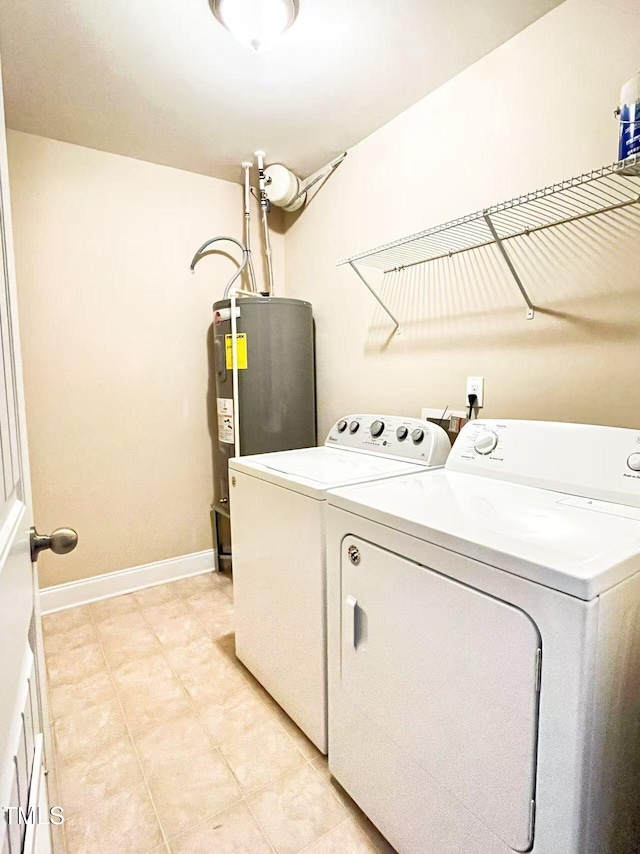 115 Ballyliffen Ln, Cary, NC 27519 - laundry area with washing machine and dryer, electric water heater, baseboards, and light tile patterned flooring
