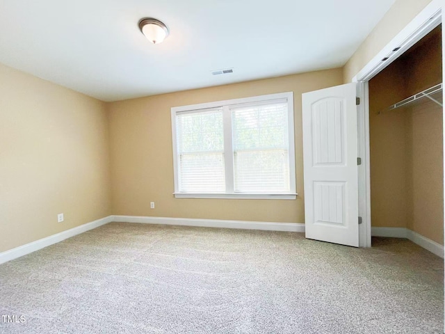 115 Ballyliffen Ln, Cary, NC 27519 - unfurnished bedroom featuring carpet floors, baseboards, and a closet