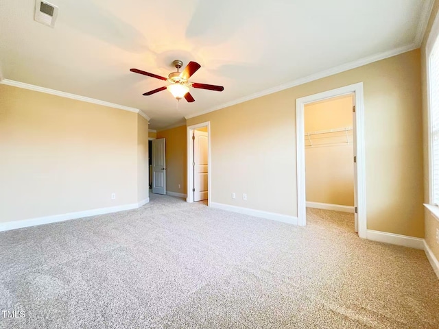 115 Ballyliffen Ln, Cary, NC 27519 - unfurnished bedroom with crown molding, light carpet, baseboards, a walk in closet, and ceiling fan