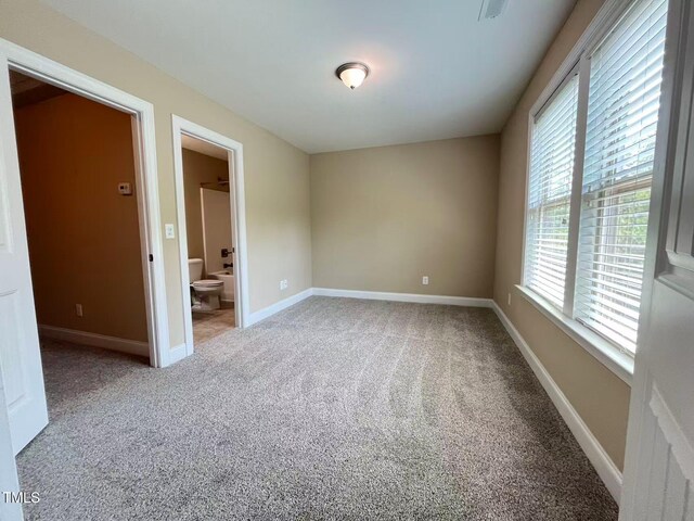 115 Ballyliffen Ln, Cary, NC 27519 - carpeted spare room featuring baseboards