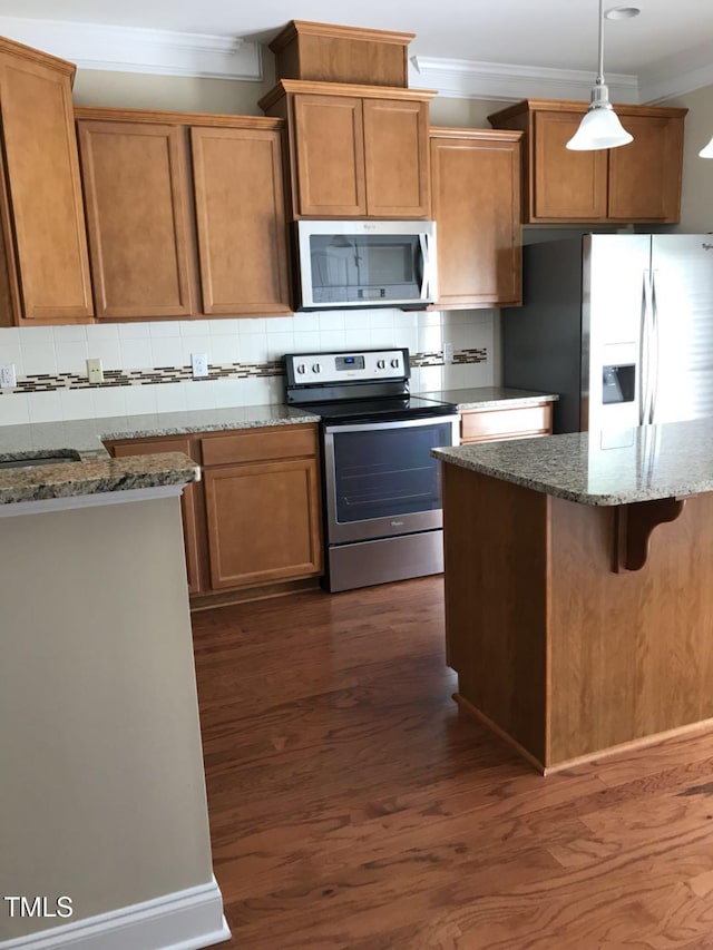 115 Ballyliffen Ln, Cary, NC 27519 - kitchen with appliances with stainless steel finishes, ornamental molding, backsplash, stone counters, and pendant lighting